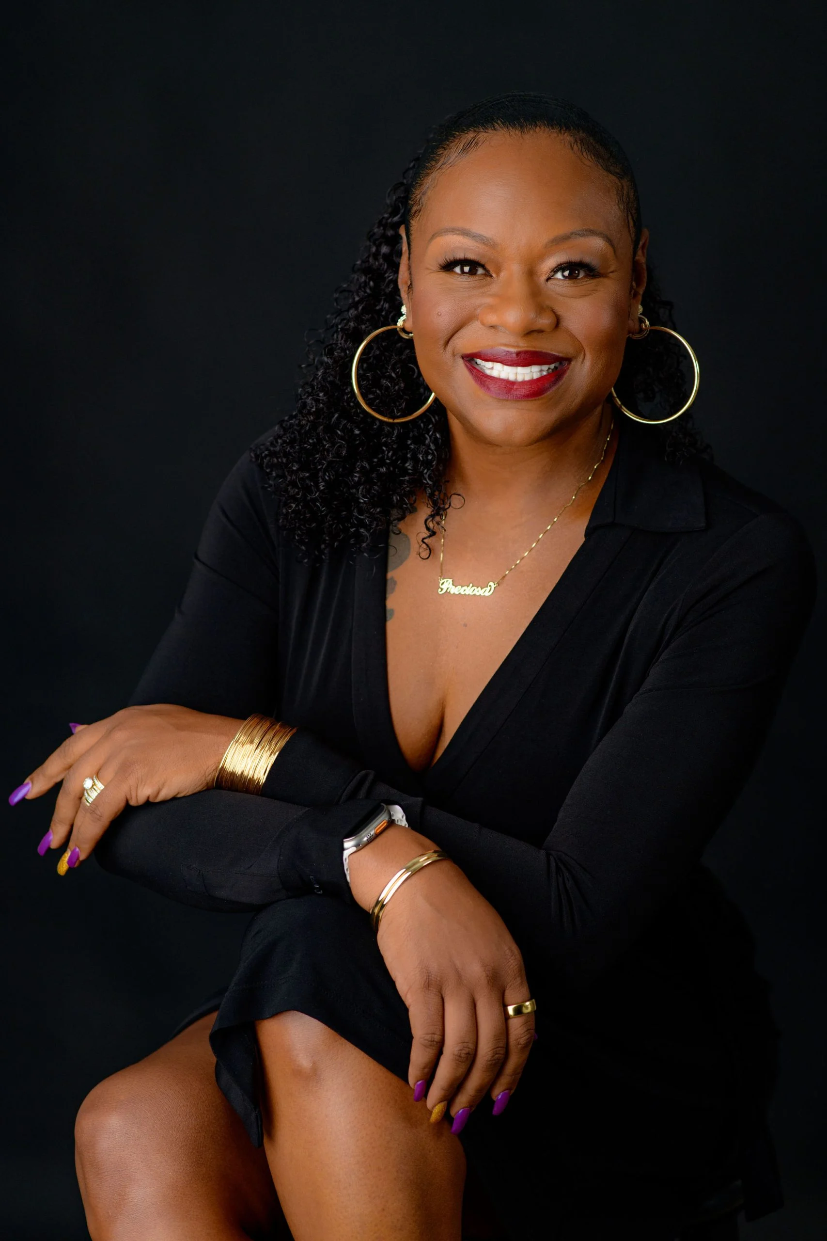 Professional portrait of Precious “Preciosa” Myers-Brown, Chief Innovation and Dream Officer (CINO), Founder, and CEO, smiling confidently in a leadership pose